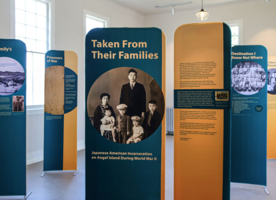 Photograph of boards with words and pictures that are part of a historical exhibit