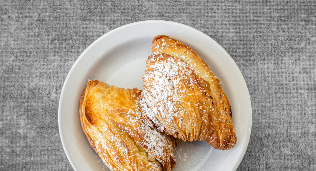 Two Italian pastries on a white plate
