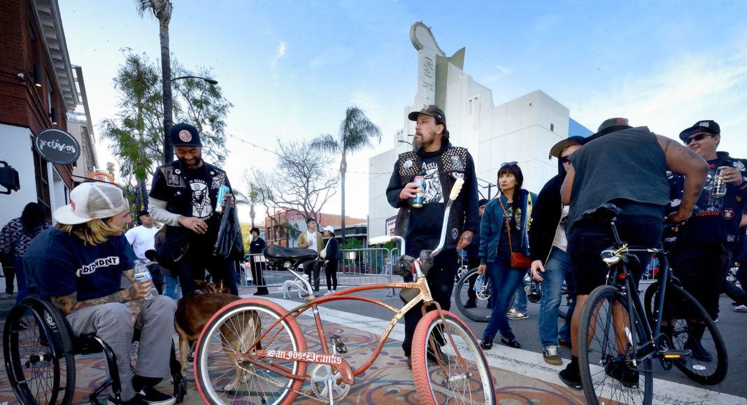 Group of people congregating on a San Jose street intersection