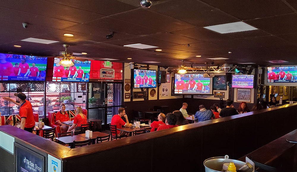 Interior of a sparts pub with many TV screens