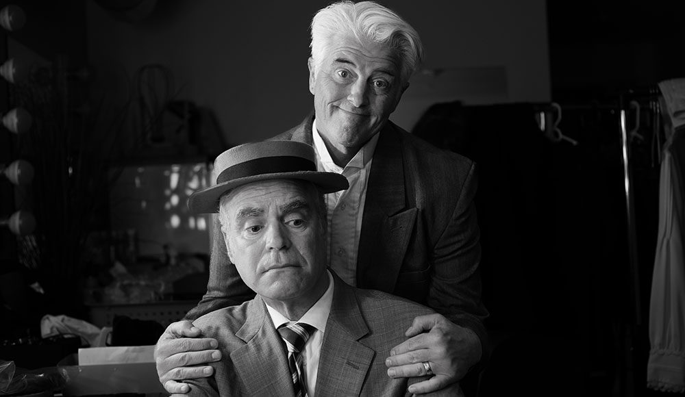 Black-and-white photo of two men in old-fashioned suits