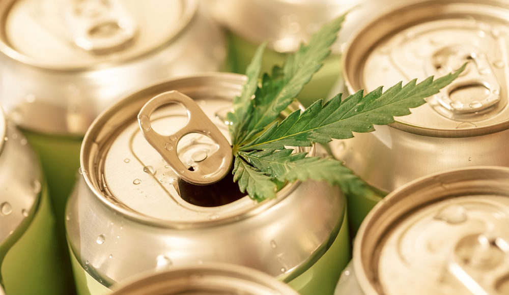 aluminum cans with a hemp leaf on top