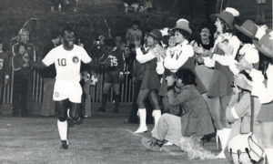 Soccer player on the field in front of a crowd