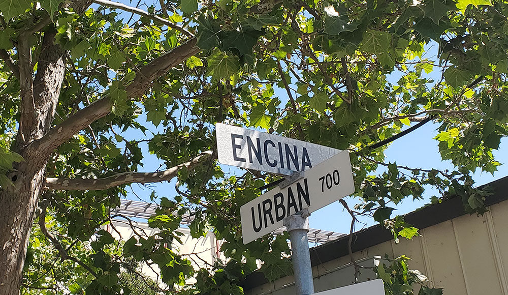 Street signs at intersection of Encina and Urban