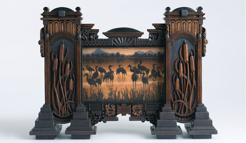 Painting encased in a large and elaborately carved wooden frame