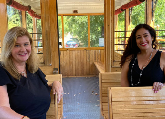 Two women sitting in a trolley