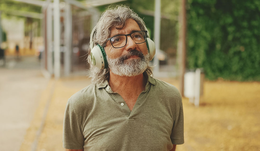 Man standing outside wearing headphones