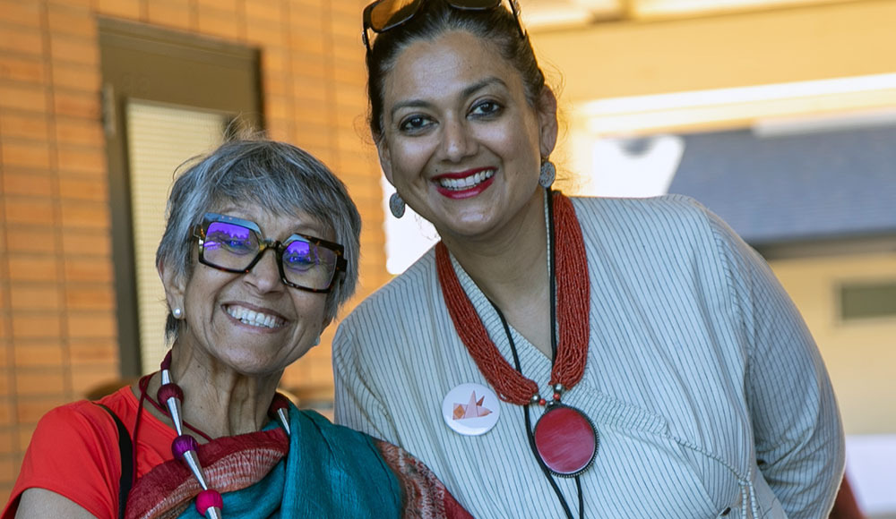 Two women smiling and posing for a photo