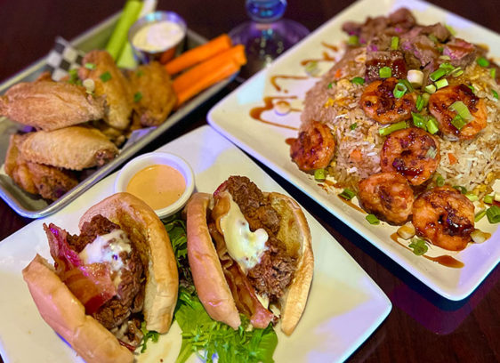 Three plates of food on a table