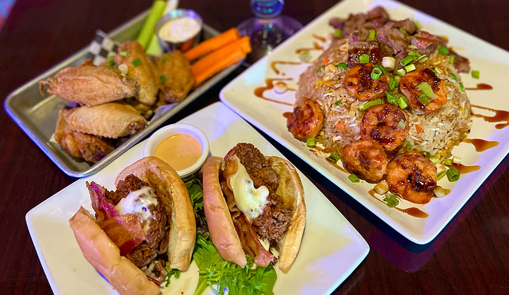 Three plates of food on a table