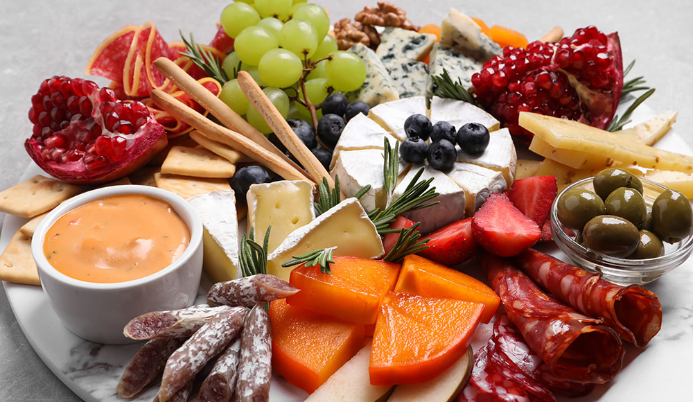 Cheese board with fruit and charcuterie