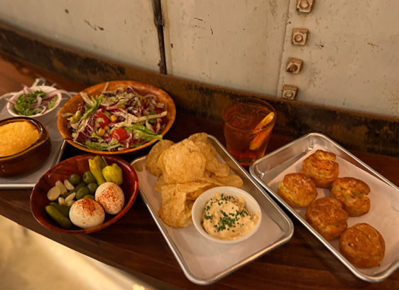 Mix of dishes laid out on a narrow table ledge