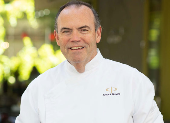 Portrait of man wearing chef’s white jacket