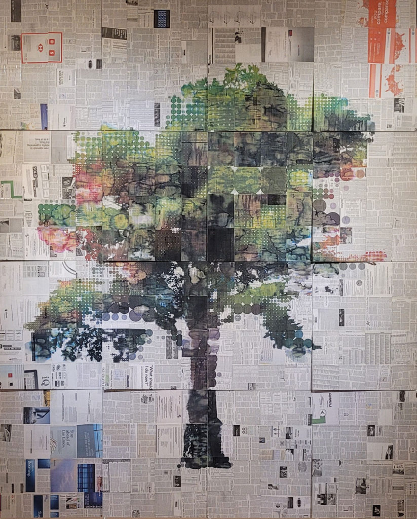 Image of a tree printed on a background of newspaper pages