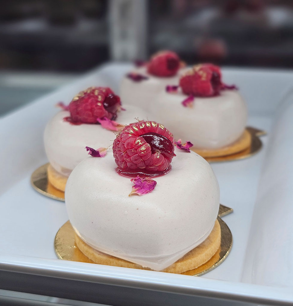 A fancy sweet topped by a raspberry