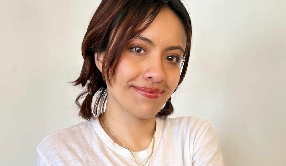 Woman wearing a white T-shirt and looking at the camera