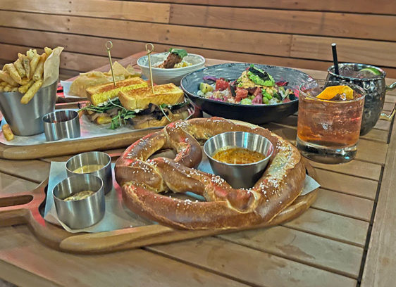 Wooden table loaded with various dishes