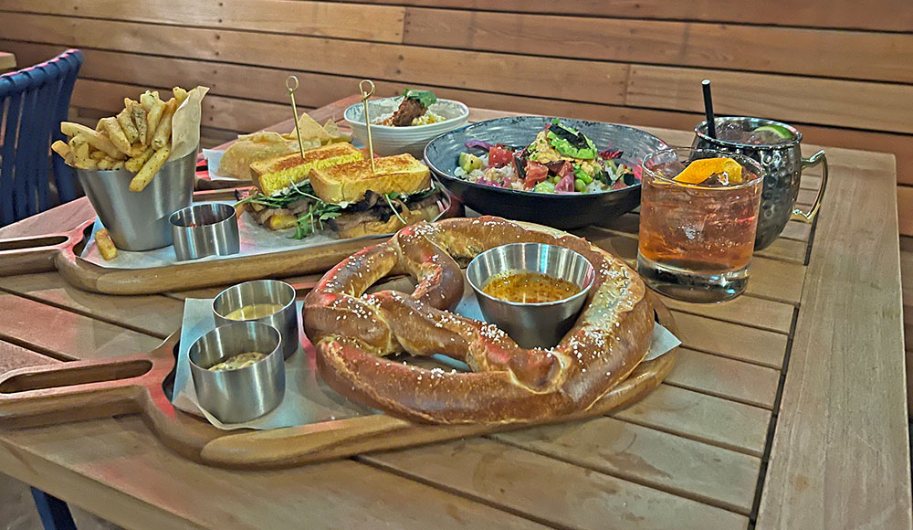 Wooden table loaded with various dishes