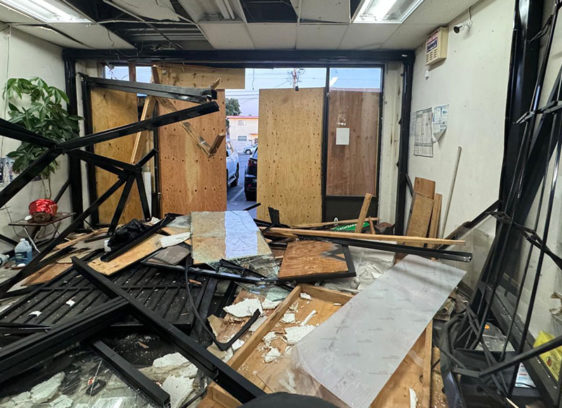 Commercial space broken into despite boards and bars on windows