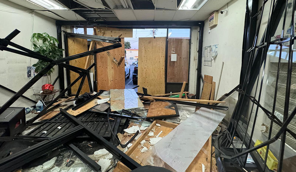 Commercial space broken into despite boards and bars on windows