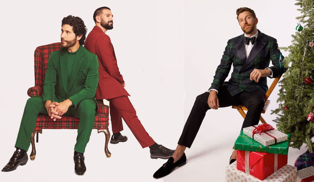 Three men and a Christmas tree on a light-colored background