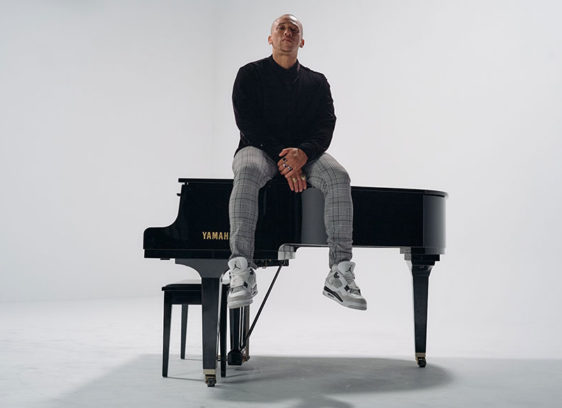 Man sitting on a piano