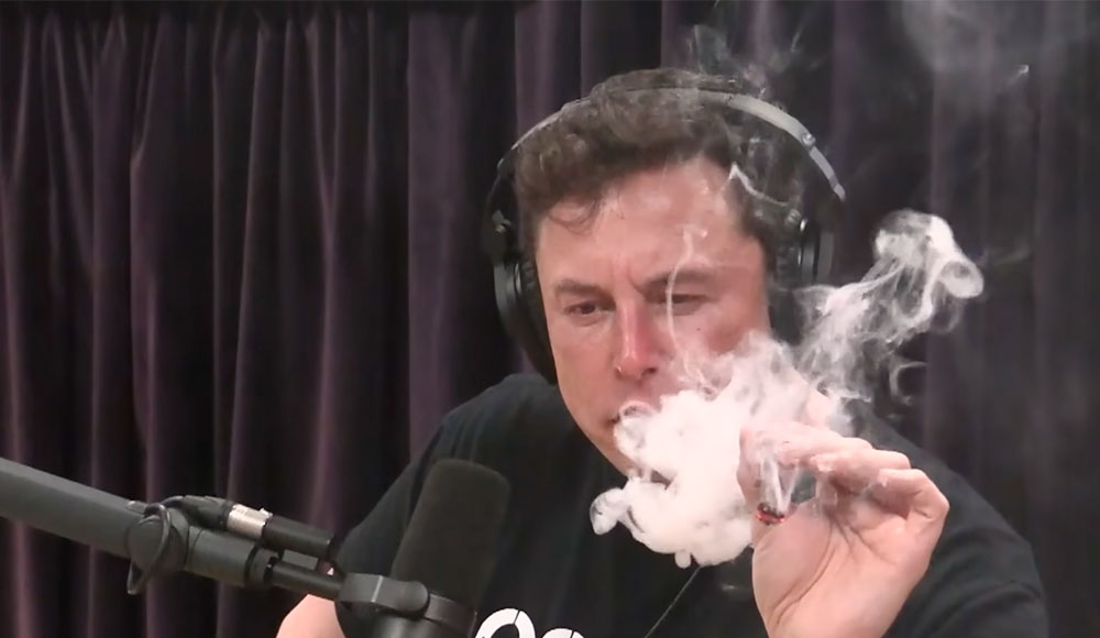 Elon Musk blowing smoke