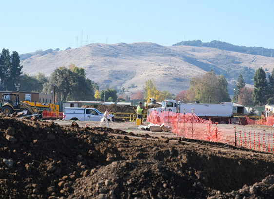 Construction site with mountain scenery behind it