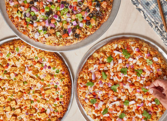 Three pizzas on a tabletop